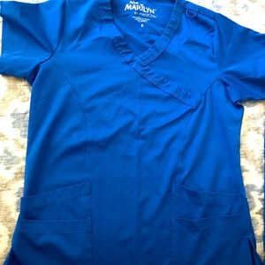 3 sets of Royal blue scrubs, size Medium. LIKE NEW!